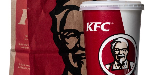 "Miami, USA - March 23, 2012: KFC soda cup with take out bag. KFC brand is owned by KFC Corporation and a subsidiary of Yum! Brands, Inc."
