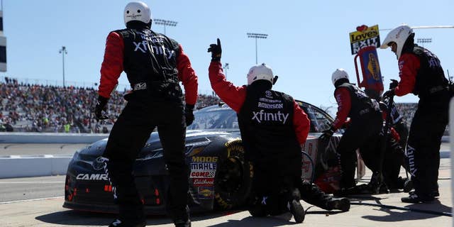 Carl Edwards comes in for a pit stop during the Sprint Cup auto race at Richmond International Raceway in Richmond, Va., Sunday, April 24, 2016. (AP Photo/Chet Strange)