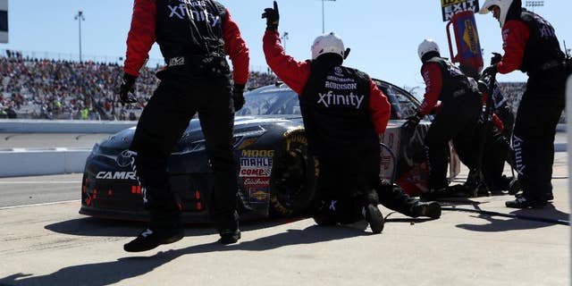 Carl Edwards comes in for a pit stop during the Sprint Cup auto race at Richmond International Raceway in Richmond, Va., Sunday, April 24, 2016. (AP Photo/Chet Strange)