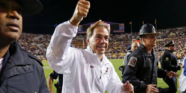 LSU head coach Les Miles yells at a referee in the second half of an NCAA college football game against Alabama in Baton Rouge, La., Saturday, Nov. 8, 2014. Alabama won in overtime 20-13. (AP Photo/Gerald Herbert)