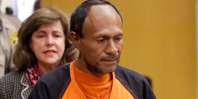 Francisco Sanchez, right, is lead into the courtroom by San Francisco Public Defender Jeff Adachi, left, and Assistant District Attorney Diana Garciaor, center, for his arraignment at the Hall of Justice on Tuesday, July 7, 2015 in San Francisco. Prosecutors have charged the Mexican immigrant with murder in the waterfront shooting death of 32-year-old Kathryn Steinle. (Michael Macor/San Francisco Chronicle via AP, Pool)