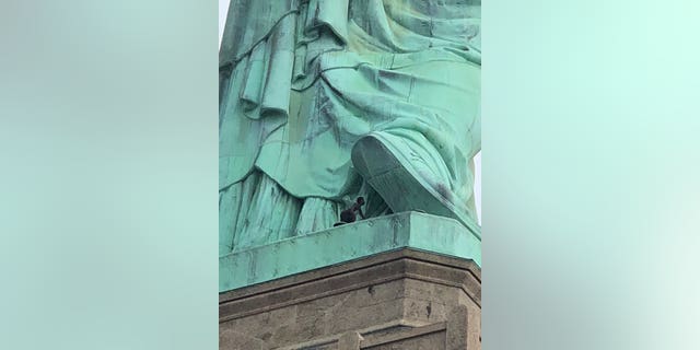 The woman who climbed the Statue of Liberty protested alongside New York-based activist group Rise and Resist earlier on Wednesday before scaling the national monument.