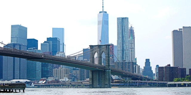 One World Trade Center, Brooklyn Bridge and Airplane flying by.