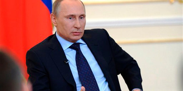March 4, 2014: President Vladimir Putin answers journalists' questions on current situation in Ukraine at the Novo-Ogaryovo presidential residence outside Moscow.