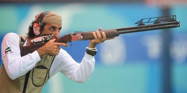Ahmed Almaktoum of UAE shoots during the qualifying round of the men's trap competition at the Beijing 2008 Olympic Games August 10, 2008.