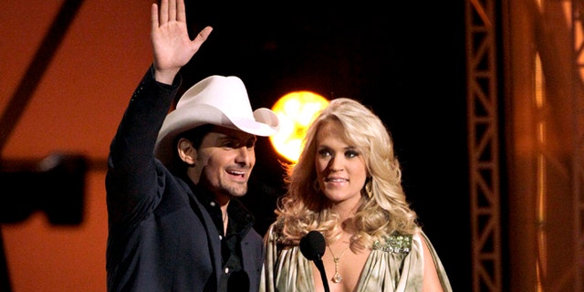 Nov. 9, 2011: This file photo shows hosts Brad Paisley, left, and Carrie Underwood speak during the 45th Annual CMA Awards in Nashville, Tenn.