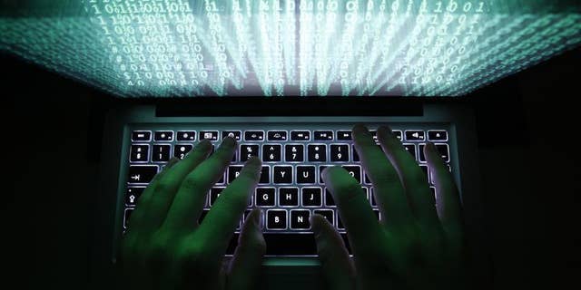 A man types on a computer keyboard in Warsaw in this February 28, 2013 illustration file picture. REUTERS/Kacper Pempel/Files