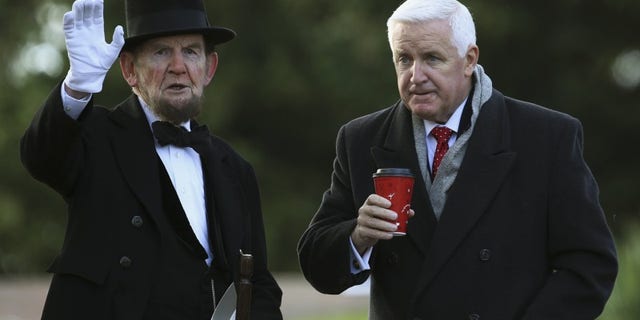James Getty (L), portraying U.S. President Abraham Lincoln, chats with Pennsylvania Republican Governor Tom Corbett (R) before delivering the Gettysburg Address at the Gettysburg National Cemetery in Pennsylvania November 19, 2013. REUTERS/Gary Cameron