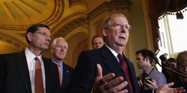 U.S. Senate Minority Leader Mitch McConnell (R-KY) speaks to the media following a Senate cloture vote on budget bill on Capitol Hill in Washington December 17, 2013. REUTERS/Yuri Gripas