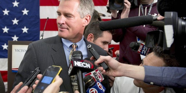 Former U.S. Republican Senator Scott Brown, takes a question from a member of the media after announcing that he will explore a run for the U.S. Senate at the Northeast Republican Leadership Conference in Nashua, New Hampshire March 14, 2014. REUTERS/Gretchen Ertl