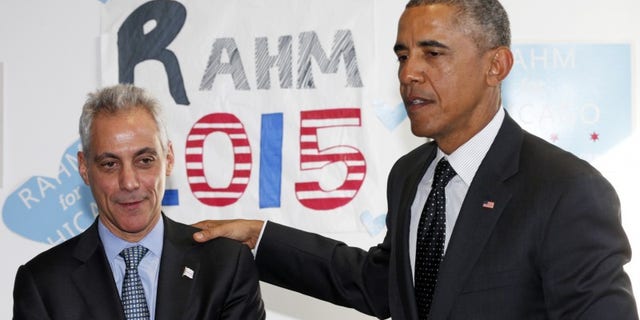 U.S. President Barack Obama puts his hand on Chicago Mayor Rahm Emanuel's shoulder as they visit a campaign office in Chicago February 19, 2015. REUTERS/Kevin Lamarque