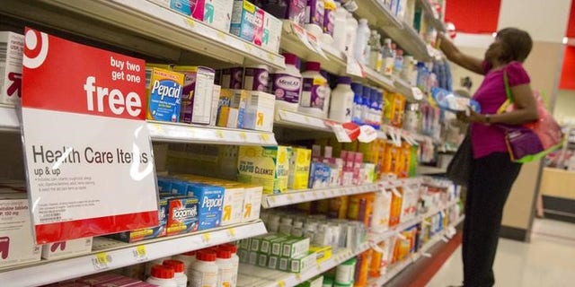 A customer shops in the pharmacy department of a Target store in the Brooklyn borough of New York June 15, 2015. REUTERS/Brendan McDermid