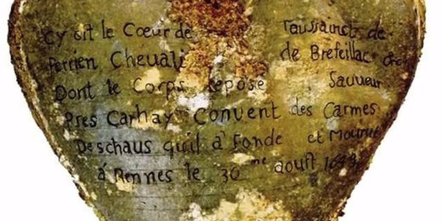 A heart-shaped lead urn with an inscription identifying the contents as the heart of Toussaint Perrien, Knight of Brefeillac, found during excavation of the ruins of the medieval Jacobins convent in Rennes, France is shown in this handout photo provided by Rozenn Colleter on December 2, 2015. REUTERS/Rozenn Colleter/Ph.D./INRAP/Handout via Reuters