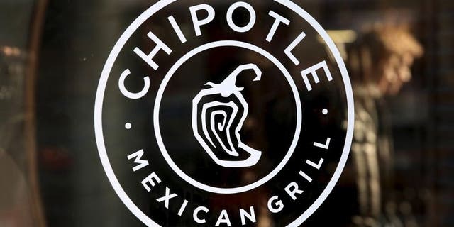 A logo of Chipotle Mexican Grill is seen on a store entrance in Manhattan, New York in this November 23, 2015 file photo. REUTERS/Andrew Kelly/Files