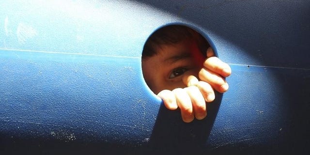 A young cancer patient plays at the opening of a summer camp outside the King Hussein Cancer center in Amman July 1, 2012. REUTERS/Ali Jarekji