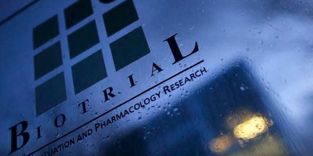A logo is seen on a glass sign in front of the entrance of the Biotrial laboratory building in Rennes, France, January 15, 2016. REUTERS/Stephane Mahe