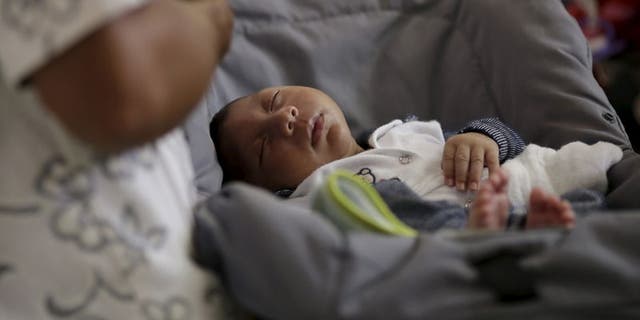 Gustavo Henrique, who has microcephaly, son of Jaqueline Maria and Geovane Silva, undergoes medical treatment at the Oswaldo Cruz Hospital in Recife, Brazil, January 26, 2016. REUTERS/Ueslei Marcelino