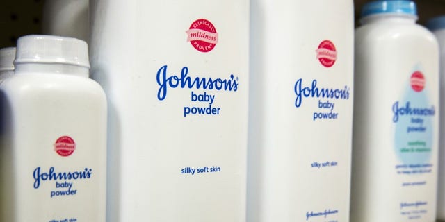   Bottles of Johnson & amp; Johnson baby powder line a pharmacy shelf in New York. (Reuters) 
