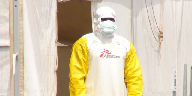 A Doctors Without Borders health worker stands in an Ebola virus treatment center in Conakry