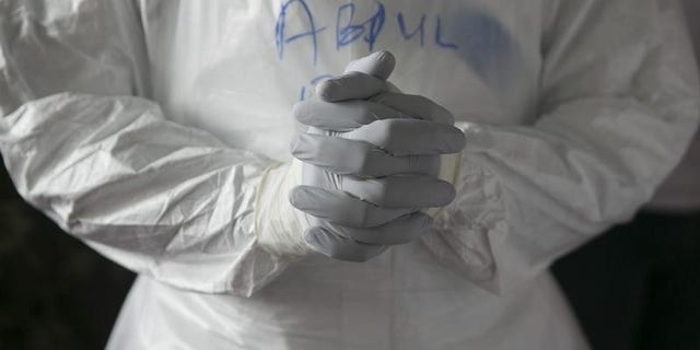 Sierra Leonean doctor practises wearing protective clothing in the Ebola Training Academy in Freetown, Sierra Leone