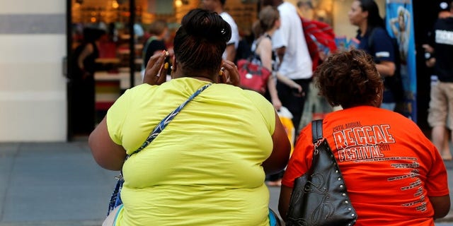 Women sit on bench in New York