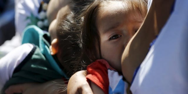 Women breastfeed babies during an event, at Chapultepec Park in Mexico City