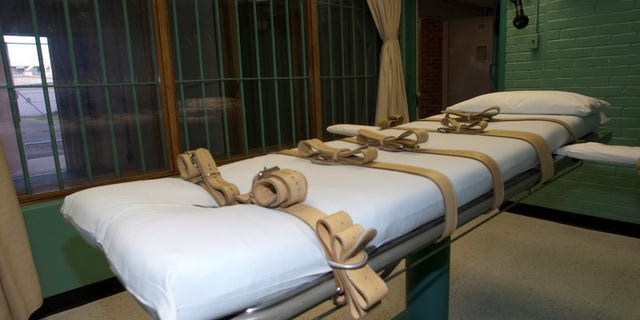 The death chamber and the steel bars of the viewing room are seen at the state penitentiary in Huntsville, Texas