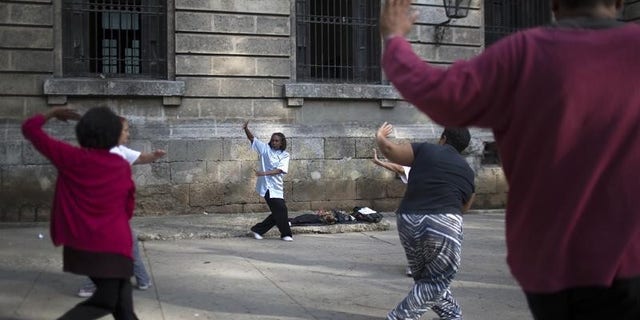 People practise Tai Chi in Havana