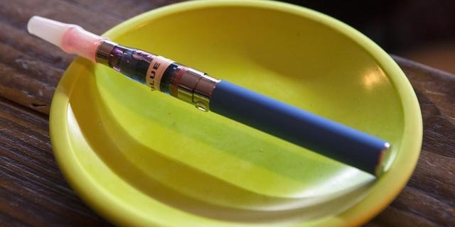 An e-cigarette sits in a tray on the bar at the Henley Vaporium in New York City