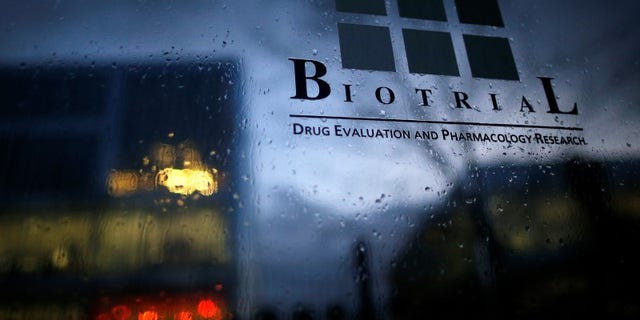 A logo is seen on a sign in front of the entrance of the Biotrial laboratory building in Rennes