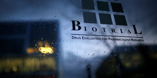 A logo is seen on a sign in front of the entrance of the Biotrial laboratory building in Rennes