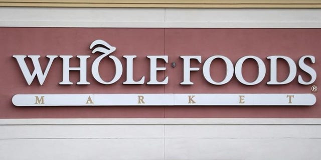A Whole Foods Market store logo is pictured on a building in Boca Raton, Florida