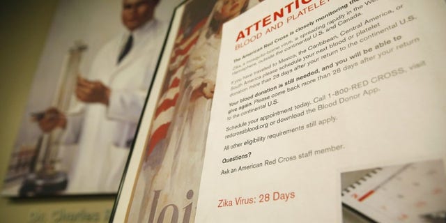 Sign explaining the parameters concerning the Zika virus and blood donations is seen at the American Red Cross Charles Drew Donation Center in Washington
