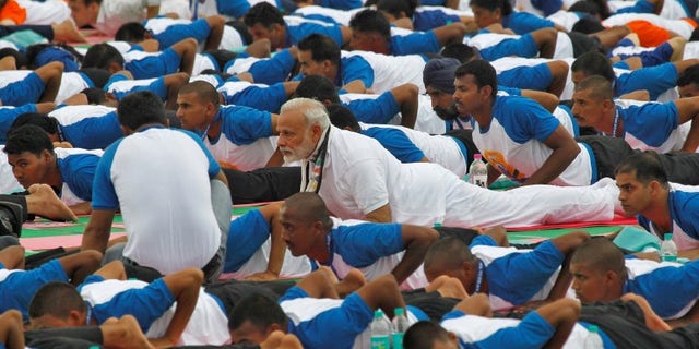 India's PM Modi performs yoga during World Yoga Day in Chandigarh