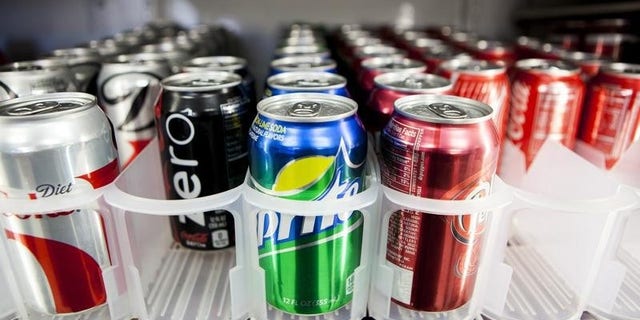 Cans of soda are displayed at Kwik Stops Liquor in San Diego
