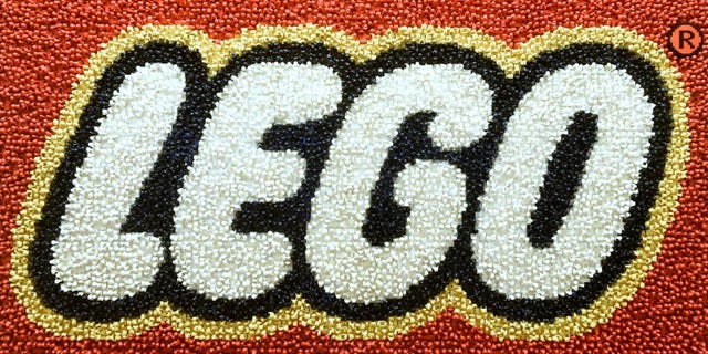 A Lego logo adorns a wall at the headquarters of the Danish toy company during the annual news conference in Billund