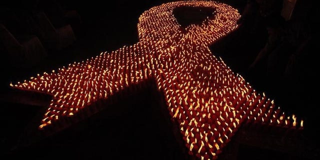 About 2880 candles are seen lit during a World AIDS Day event in Jakarta
