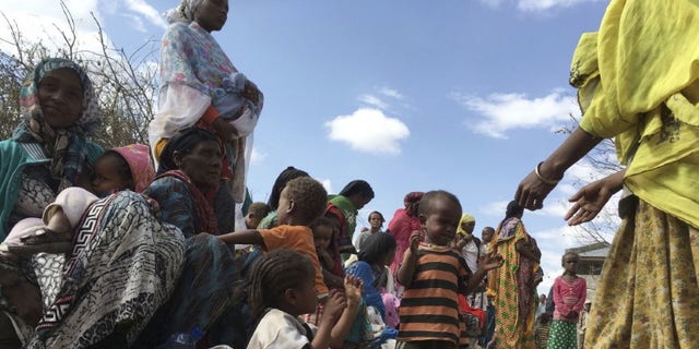 Malnourished children wait for medical attention at the Halo health post in Halo village, a drought-stricken area in Oromia region in Ethiopia