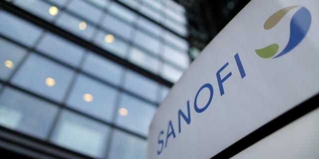 A logo is seen in front of the entrance at the headquarters of French drugmaker Sanofi in Paris