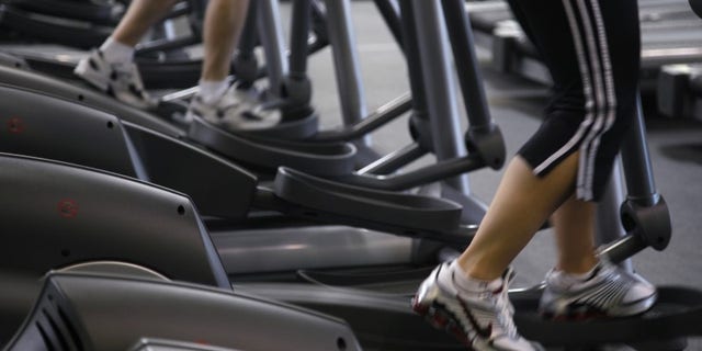 Clients work out on machines at the Bally Total Fitness facility in Arvada
