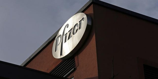 A company logo is seen at a Pfizer office in Dublin