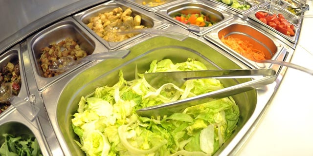 Pre-cut vegetables of self service salad bar are displayed for sale in shop in northern German town of Hamburg