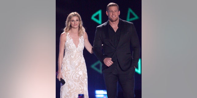 Host Erin Andrews, left, and J.J. Watt appear on stage at the CMT Music Awards at the Bridgestone Arena on Wednesday, June 8, 2016, in Nashville, Tenn. (Photo by Wade Payne/Invision/AP)