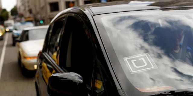 The Uber logo is seen on a vehicle near Union Square in San Francisco, California, U.S. May 7, 2015.    