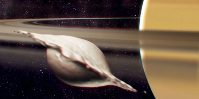 Saturn's moon Atlas got its flat, ravioli-like shape from the merging collision of two similar-size bodies, according to new research. Here, Atlas is shown mid-collision.