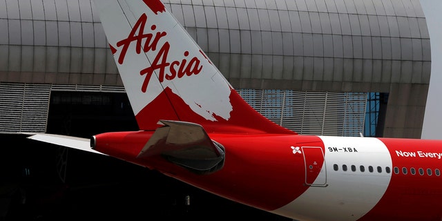 The Malaysia-based airline was accused of deliberately trying to override a passenger clearance system.