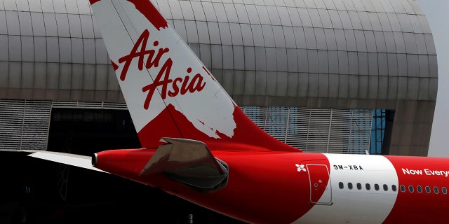 The Malaysia-based airline was accused of deliberately trying to override a passenger clearance system.