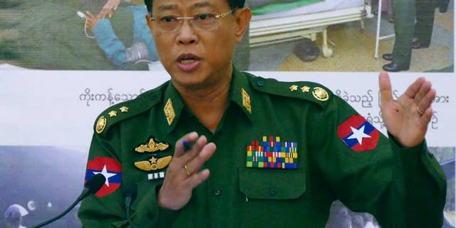 Myanmar's Chief of Military Affairs Security, Lt. Gen. Mya Tun Oo, talks to journalists during a press conference at the Defense Ministry Saturday, Feb. 21, 2015, in Naypyitaw, Myanmar. Myanmar is claiming that allied minority rebel groups and former Chinese soldiers recruited as mercenaries are supporting ethnic Kokang rebels in fighting against government troops. (AP Photo/Khin Maung Win)