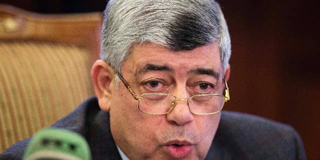 FILE - In this Monday, Jan. 26, 2015 file photo, Egypt's Interior Minister Mohammed Ibrahim speaks during a press conference in Cairo, Egypt. Egyptian President Abdel-Fattah el-Sissi reshuffled his Cabinet on Thursday, March 5, 2015, replacing the powerful minister in charge of the nation's police along with five other ministers, state television reported. It said Interior Minister Mohammed Ibrahim, who is in charge of police, was replaced by another police general, Magdy Abdel-Ghafar, a career officer in the feared State Security Agency.(AP Photo/Hassan Ammar, File)