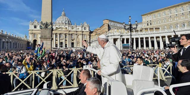 Pope Francis waves to faithful during a jubilee audience in St. Peter's Square, at the Vatican Saturday, Oct. 22, 2016. (L"osservatore Romano/Pool Photo via AP)